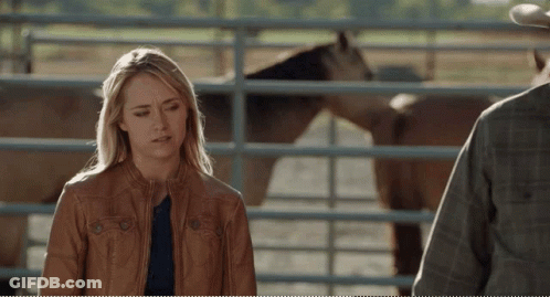 Woman In Brown Leather Jacket Next To Man In Plaid Shirt GIF