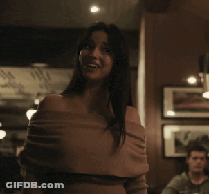Woman In Brown Off-Shoulder Top Crying In Dark Room GIF