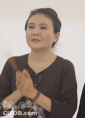 Woman In Brown Shirt Clapping GIF