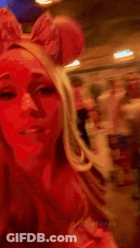 Woman In Bunny Ear Headband Saying Here We Go GIF