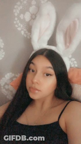 Woman In Bunny Ears And Black Top GIF