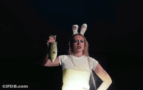 Woman In Bunny Ears Holding Fish GIF