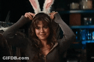 Woman In Bunny Ears Smiling GIF
