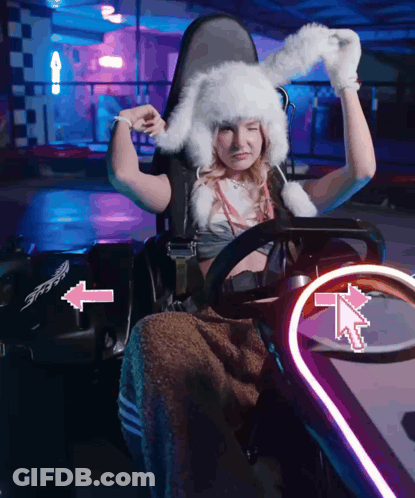 Woman In Bunny Hat In Go Kart With Arrows GIF