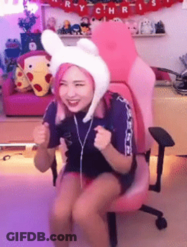 Woman In Bunny Hat Sitting In Pink Chair GIF