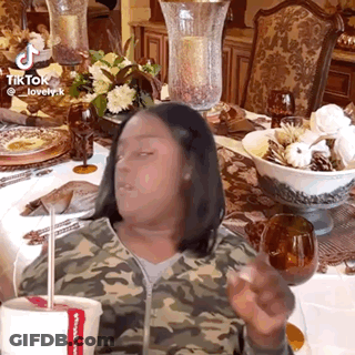 Woman In Camouflage Jacket Holding Chicken Cup GIF