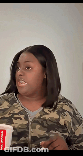 Woman In Camouflage Jacket Holding Chicken Cup GIF
