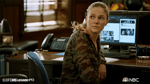 Woman In Camouflage Shirt At Desk With #Chicagopd GIF