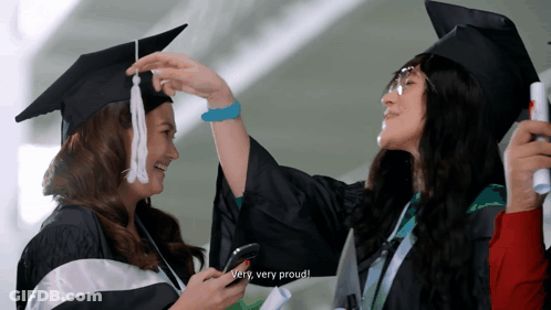 Woman In Cap And Gown Says Proud GIF