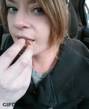 Woman In Car Eating Penny With Finger GIF
