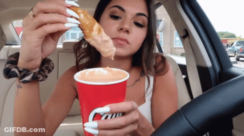 Woman In Car Eating Pizza And Drinking Caffe GIF