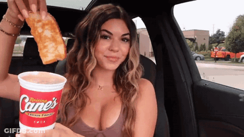 Woman In Car Holding Cane, Cup, And Pizza GIF
