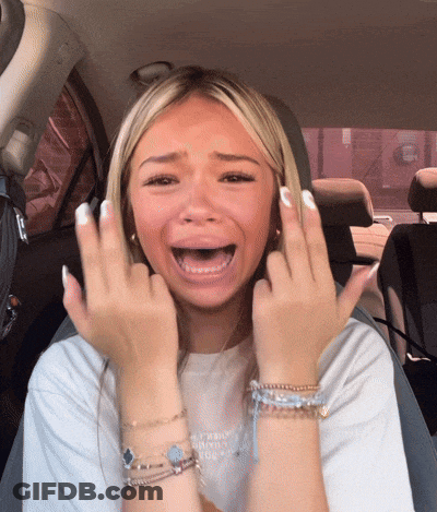 Woman In Car Making Face GIF