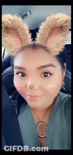 Woman In Car With Bunny Ears And Necklace GIF