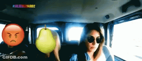 Woman In Car With Pear And Angry Face GIF