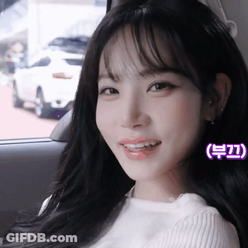 Woman In Car With Purple Sticker Saying A GIF