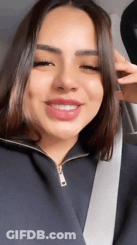 Woman In Car With Seat Belt Around Neck GIF