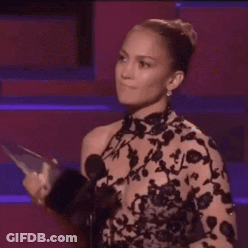 Woman In Carmille Row Shirt Holding Blue Cup GIF
