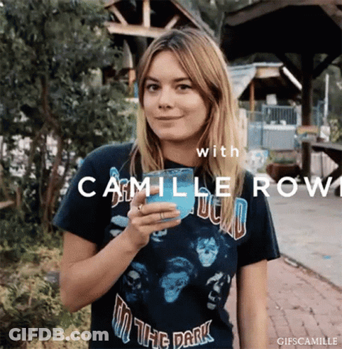 Woman In Carmille Row Shirt Holding Blue Cup GIF