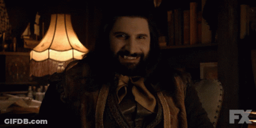 Woman In Cat Costume Holding Knife In Dark Room GIF