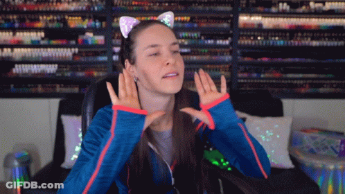 Woman In Cat Ear Headband Making A Face GIF