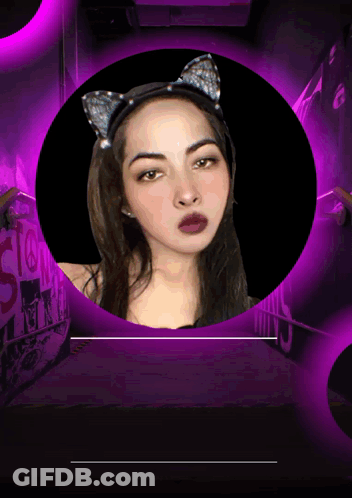 Woman In Cat Ear Headband Surrounded By Purple Lights GIF