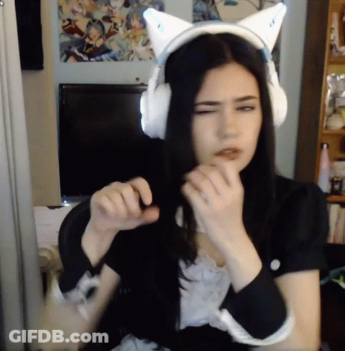 Woman In Cat Ear Headphones Looking At Camera GIF