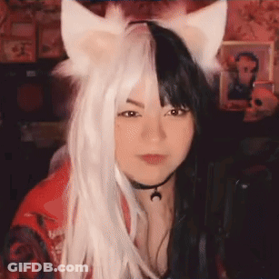 Woman In Cat Ear Wig And Choker At Microphone GIF