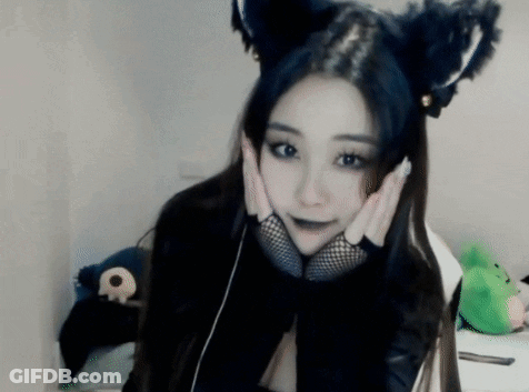Woman In Cat Ears And Fishnet Gloves Holding Face GIF