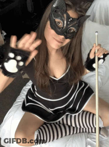 Woman In Cat Mask And Striped Socks Holding Pool Cue GIF