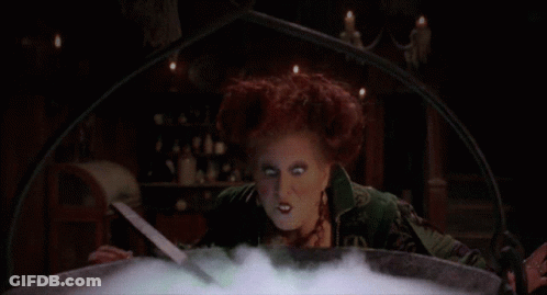 Woman In Cauldron Blowing Green Smoke GIF