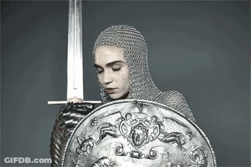 Woman In Chain Mail Holding Sword And Shield GIF