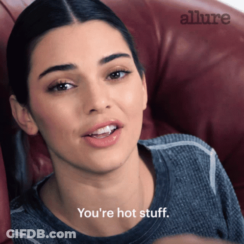 Woman In Chair Saying You're Hot Stuff GIF