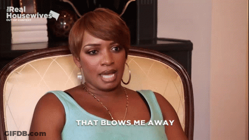 Woman In Chair That Blows Me Away GIF