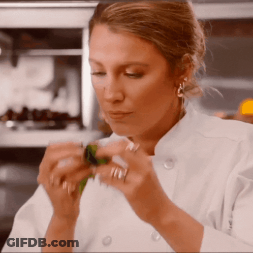 Woman In Chef Uniform Holding Something GIF