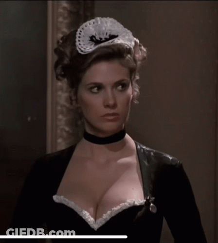 Woman In Choker And Maid Hat Looking At Camera GIF