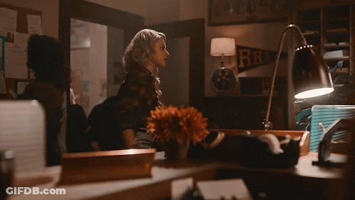 Woman In Choker And Plaid Shirt Standing Next To Woman GIF