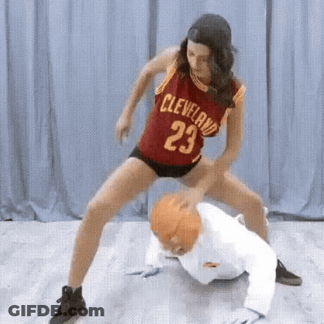 Woman In Cleveland Jersey Playing Basketball With Man In White Suit GIF