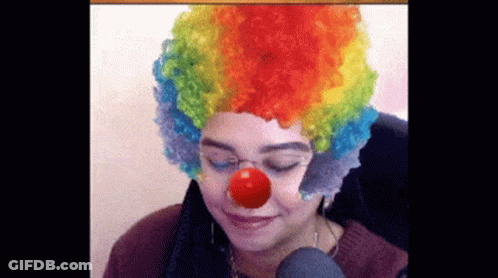 Woman In Clown Wig And Red Nose GIF