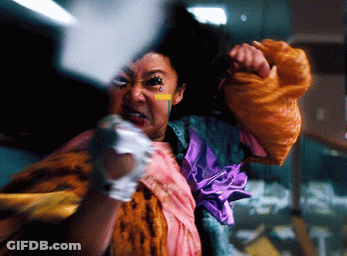 Woman In Colorful Costume With Tear On Face GIF