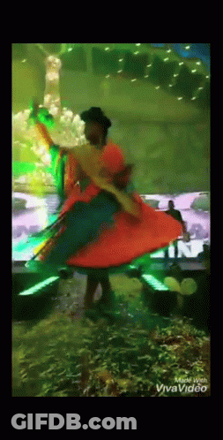 Woman In Colorful Dress Dancing Made With Vivavideo GIF