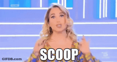 Woman In Colorful Dress Making Scoop Gesture GIF