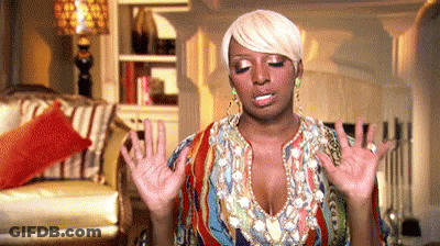 Woman In Colorful Dress Standing With Outstretched Hands GIF