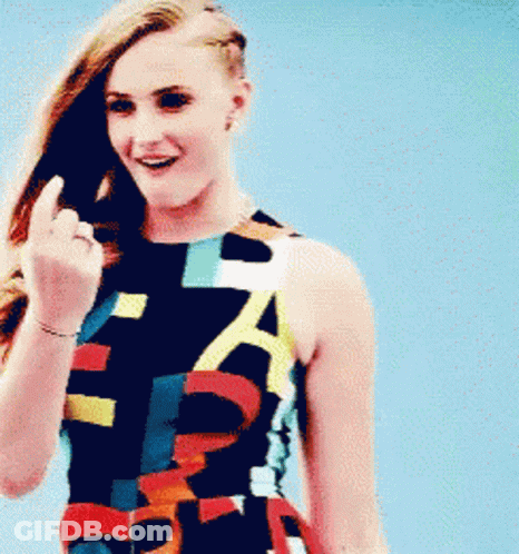Woman In Colorful Dress With A Flipping Off GIF