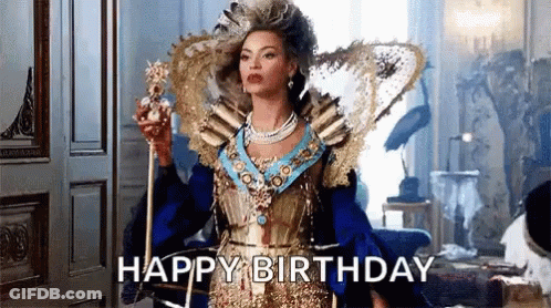 Woman In Colorful Outfit Holding Microphone On Stage GIF