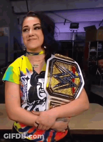Woman In Colorful Shirt Holding Wrestling Belt GIF