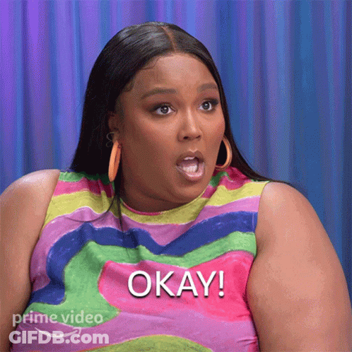 Woman In Colorful Shirt Saying Okay GIF