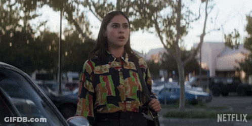 Woman In Colorful Shirt Standing Next To Car With Netflix GIF