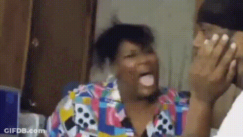 Woman In Colorful Shirt Talking On Cell Phone GIF