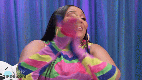 Woman In Colorful Striped Shirt And Gloves GIF